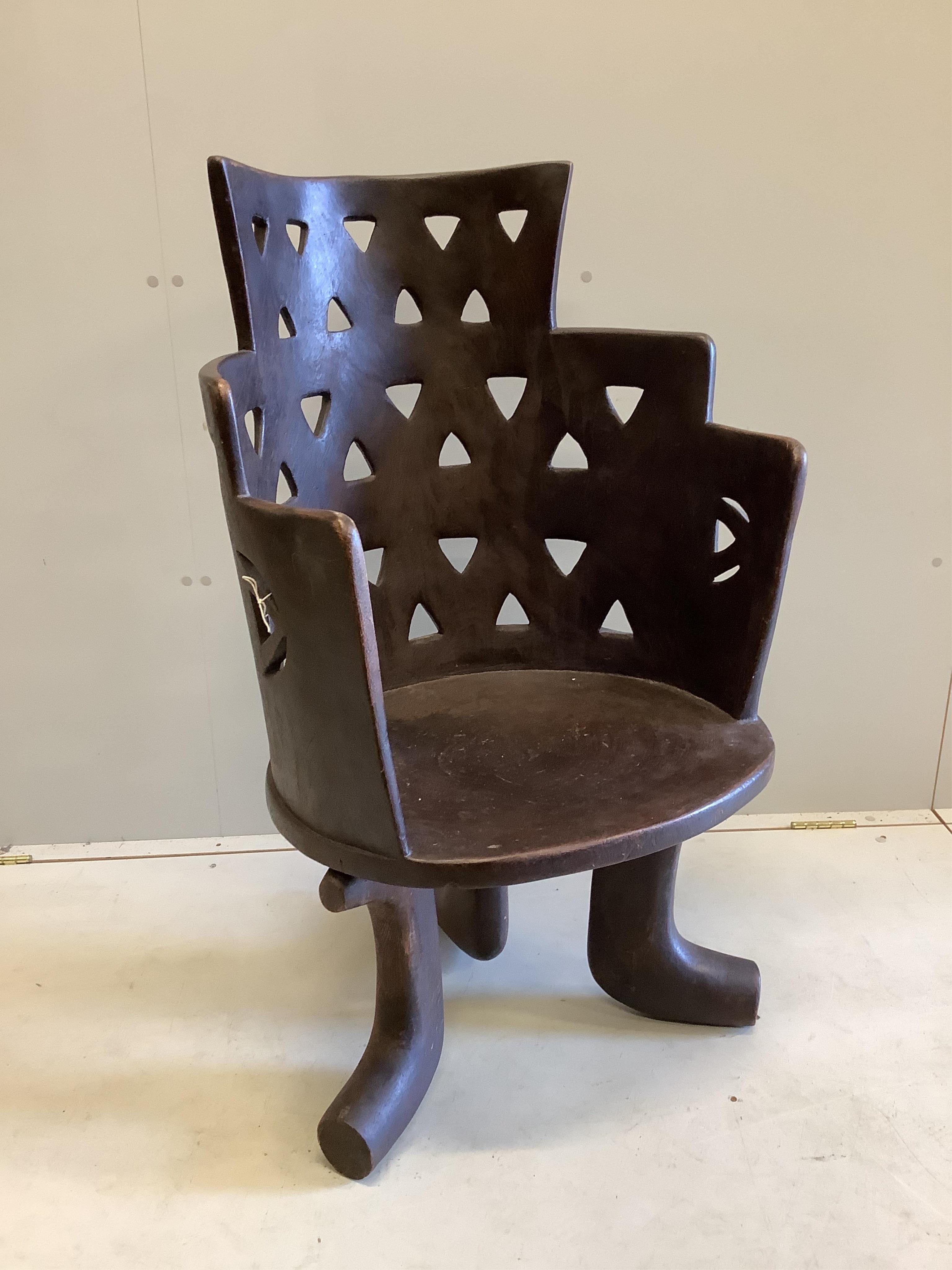 An African hardwood Jimma chair, width 62cm, depth 52cm, height 103cm